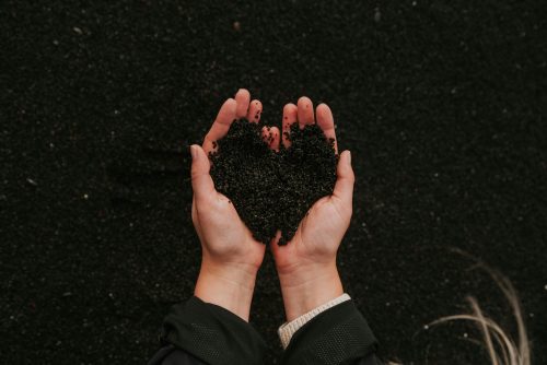 soil-in-hands-grounding-earthing