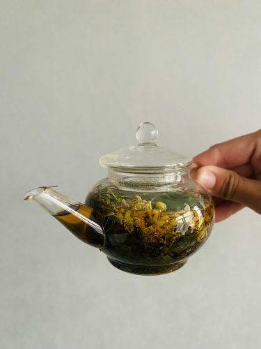 pexels-xeniya-kovaleva-89812116-12902638 grounding-herbs-in-glass-teapot
